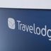 Travelodge Dartford sign on a blue wall in Dartford