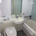 Daiwa Roynet Hotel Tsukuba bathroom with toilet, sink, bathtub, and shower in Tsukuba