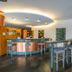 Posadas De España Cartagena bar lounge with high stools and curved counter