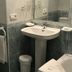 Hotel Bradomin in Vilanova de Arousa bathroom with sink, toilet, bidet, and wall mirror