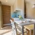 Concept Village Piccola Gardiola, San Felice del Benaco: bright dining area with kitchenette, sofa, and window