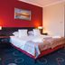 Hotel Admiral in Gdansk guest room with double bed, bedside lamps, and patterned carpet