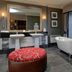Eglinton Arms Hotel, Glasgow bathroom with freestanding tub, dual sinks, large mirror and window