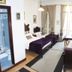 Alvares Cabral Guest House in Porto, twin beds beside French doors and an ensuite bathroom