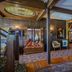 Mendocino Hotel and Garden Suites in Mendocino, ornate vintage guest room with stained-glass ceiling detail
