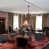 Boutique Hotel Yöpuu in Jyväskylä lounge with wine cabinet and seating area