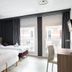 Lille City Hotel, Lille: guest room with two beds, desk, and large windows with city view