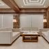 Hotel Centra-Ahmedabad in Ahmedabad lounge with beige sofas, coffee table, and modern ceiling lights