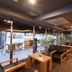 Hotel Route-Inn Kitamatsudo Ekimae lobby seating area with large windows and city street view
