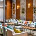 Charm Hotel Budapest lobby lounge in Budapest with sofas, tables, wall art and warm lighting