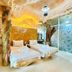 Yoko River Kwai Resort in Ban Lum Sum: cave-style room with twin beds and frosted glass wall