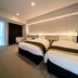 Daiwa Roynet Hotel Okinawa-Kenchomae in Naha guest room with two twin beds and window