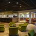 Resort Bad Boekelo lounge in Boekelo with green armchairs, bar seating and dining area