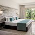 The Freij Resort by Marissol in Ayia Napa guest room with balcony garden view and king bed