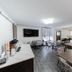 Comfort Inn & Suites Wyomissing/Reading breakfast room with tables, chairs, and wall-mounted TV