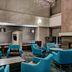 Residence Inn by Marriott Cleveland-Beachwood lounge with turquoise chairs and a fireplace in Beachwood