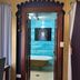 The Retreat at Froog Moore Park in Tamworth, doorway to a bathroom with a freestanding tub and blue tiled wall.
