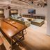 Baselite-Westbund Serviced Apartment in Shanghai lounge with long communal table, sofas, and TV