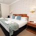 Pitbauchlie House Hotel in Dunfermline guest room with double bed, window, and bedside tables