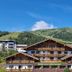 Hotel Lärchenhof in Rennweg am Katschberg with alpine mountain backdrop and chalet-style balconies
