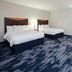 Fairfield Inn & Suites by Marriott Seattle Bremerton guest room with two beds and a large window