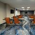 Fairfield Inn & Suites by Marriott Seattle Bremerton meeting room with tables and orange chairs in Bremerton