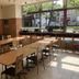 Toyoko Inn Takamatsu Hyogomachi breakfast room with tables and chairs by large street-facing windows