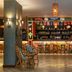 The Westin Dubai Mina Seyahi Beach Resort & Marina bar with colorful stools and woven chairs in Dubai