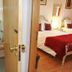 Alvares Cabral Guest House in Porto: bedroom with twin beds and an en-suite bathroom visible through open door
