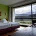 Monte Prado Hotel & Spa in Melgaço guest room with twin beds and large window overlooking mountains