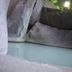 Kirishima Yunotani Sanso hot spring pool beside natural rock formations in Kirishima