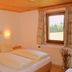 Gasthof Bärnstatt in Scheffau am Wilden Kaiser bedroom with twin bed and window mountain view