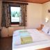 Gasthof Bärnstatt room in Scheffau am Wilden Kaiser with twin beds, window view and bedside tables