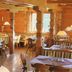 Gasthof Bärnstatt in Scheffau am Wilden Kaiser dining room with wood-paneled walls and rustic tables