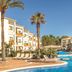 Zafiro Tropic in Alcúdia with a palm-lined outdoor pool and sun loungers
