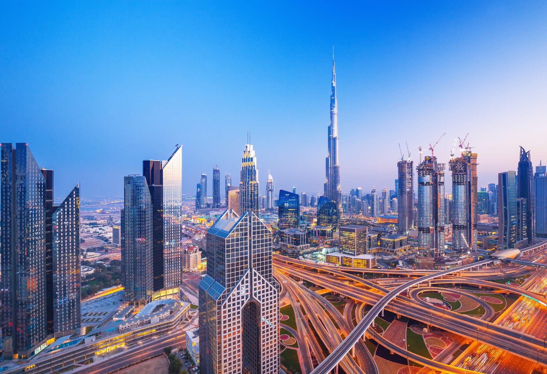 Dubai skyline at sunset with beautiful city center lights and Sheikh Zayed road traffic, Dubai, United Arab Emirates; Shutterstock ID 646922527