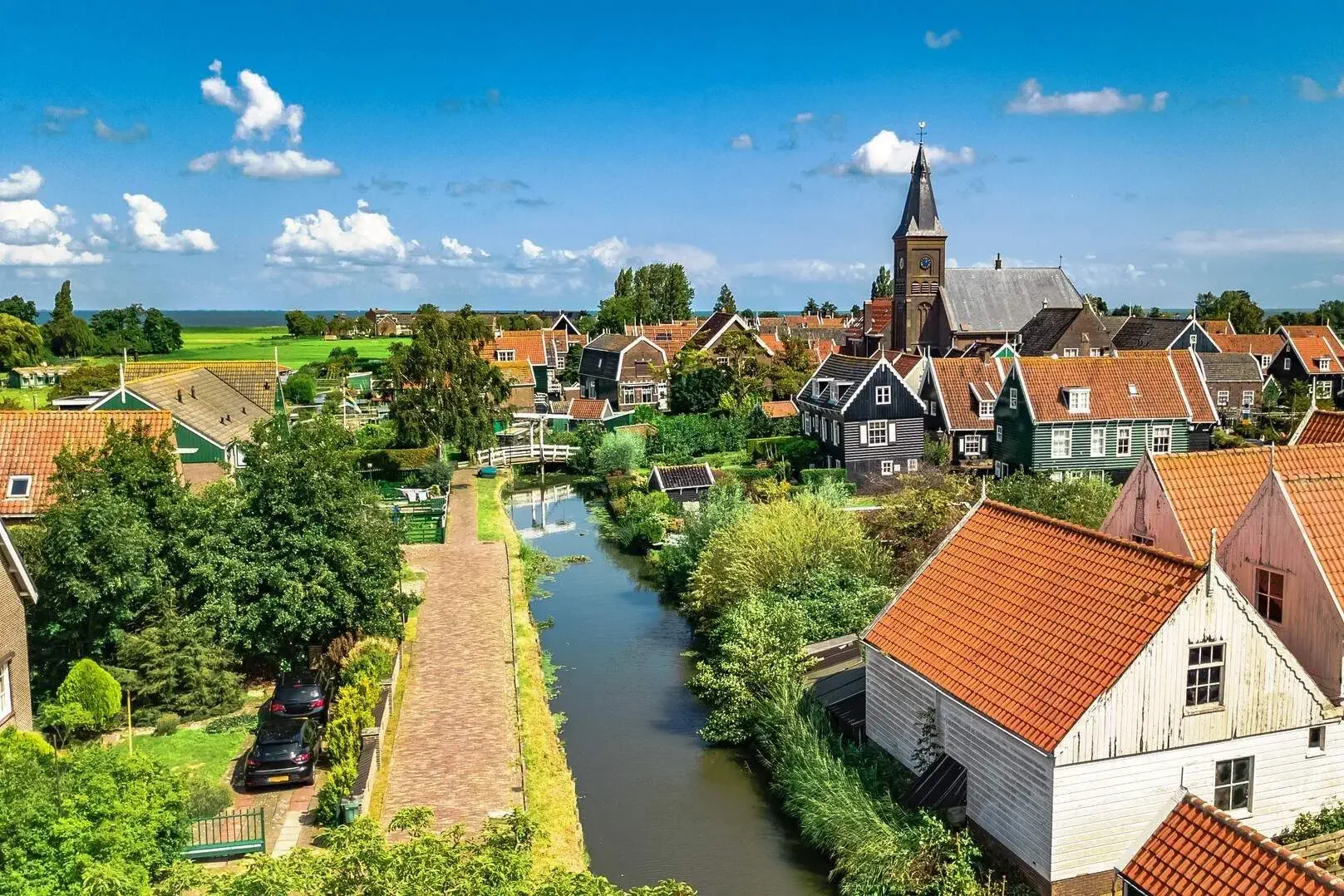 A canal in the middle of a charming village in the Netherlands