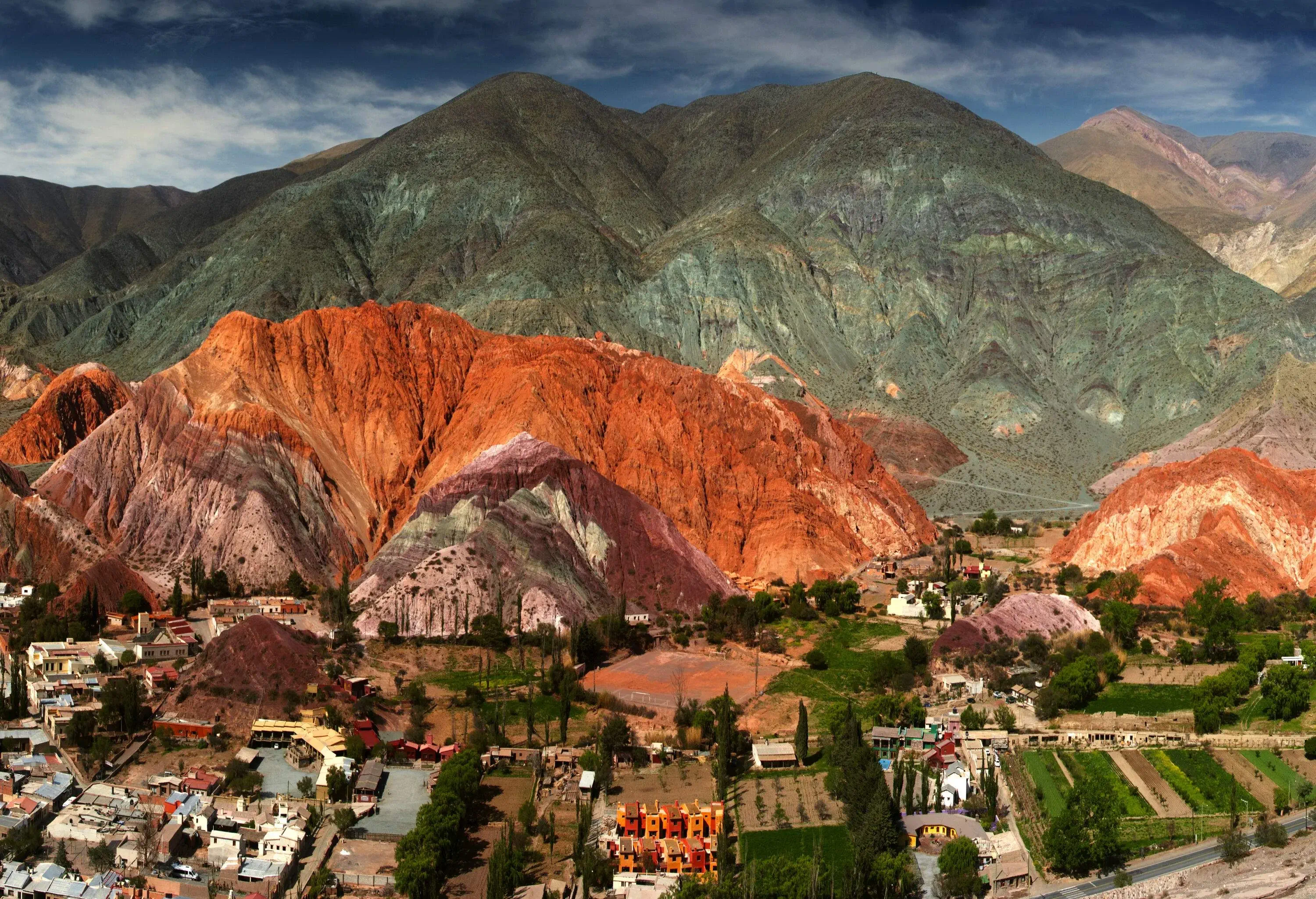 A small town in the valley beneath the mesmerizing and multi-hued mountain range.