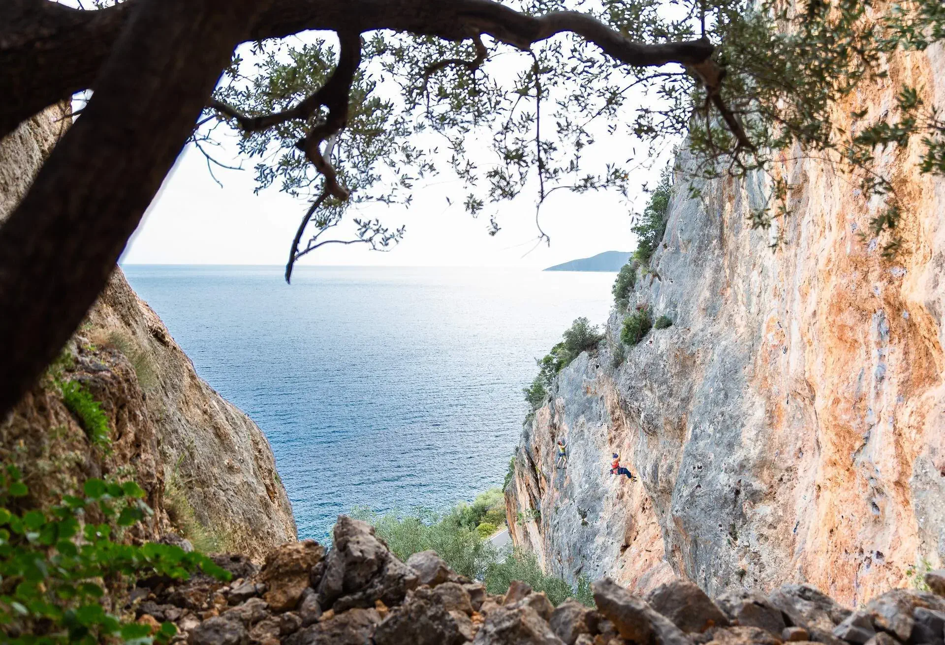 Rock climbers extreme sportsmen climbing cliff crag stone canyon sea view landscape, Leonidio travel toruism vacation, Greece.
