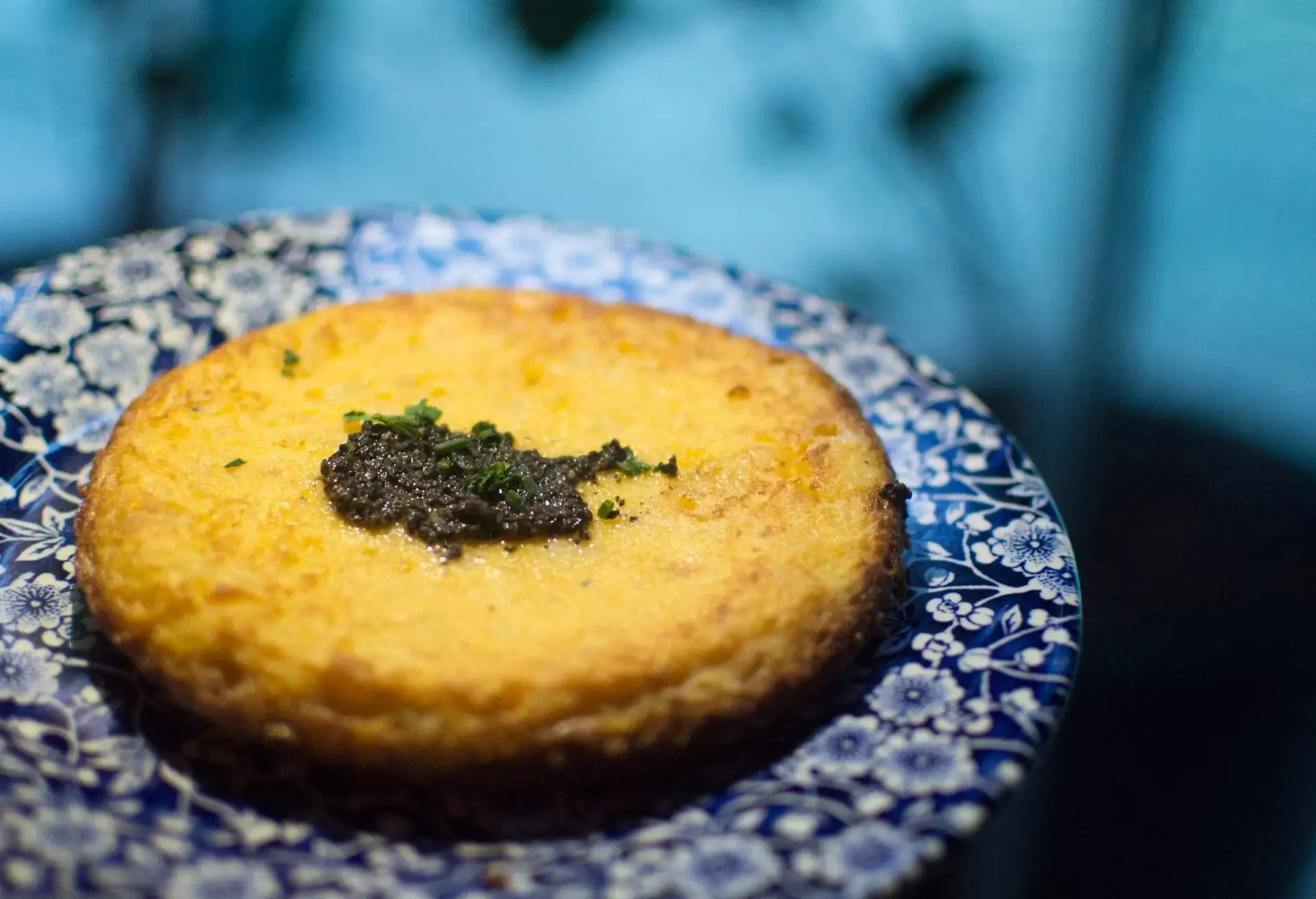 Tortilla on a blue plate with white flowers