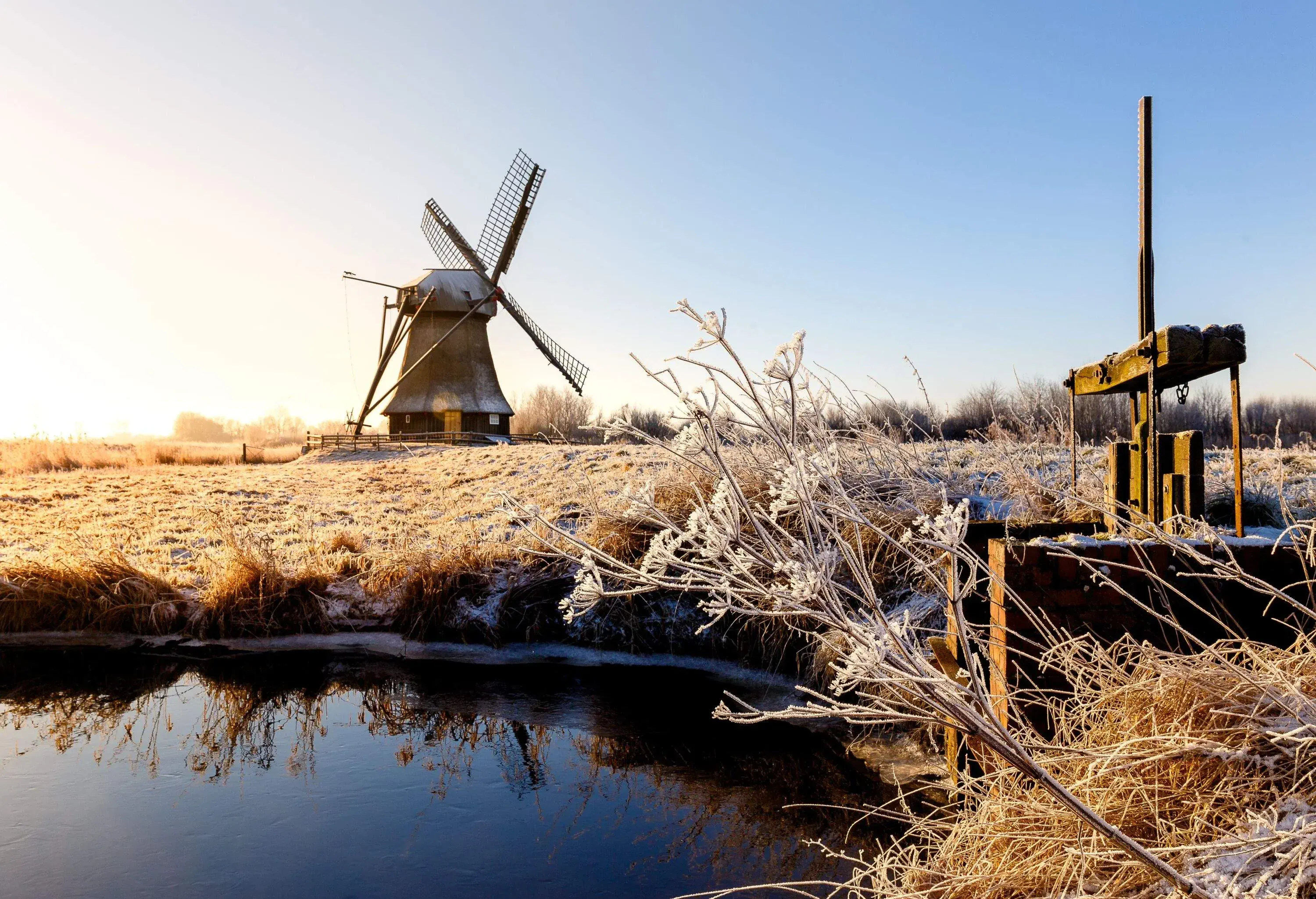 The Wedelfelder mill at sunrise on a sunny frosty winter morning in January.