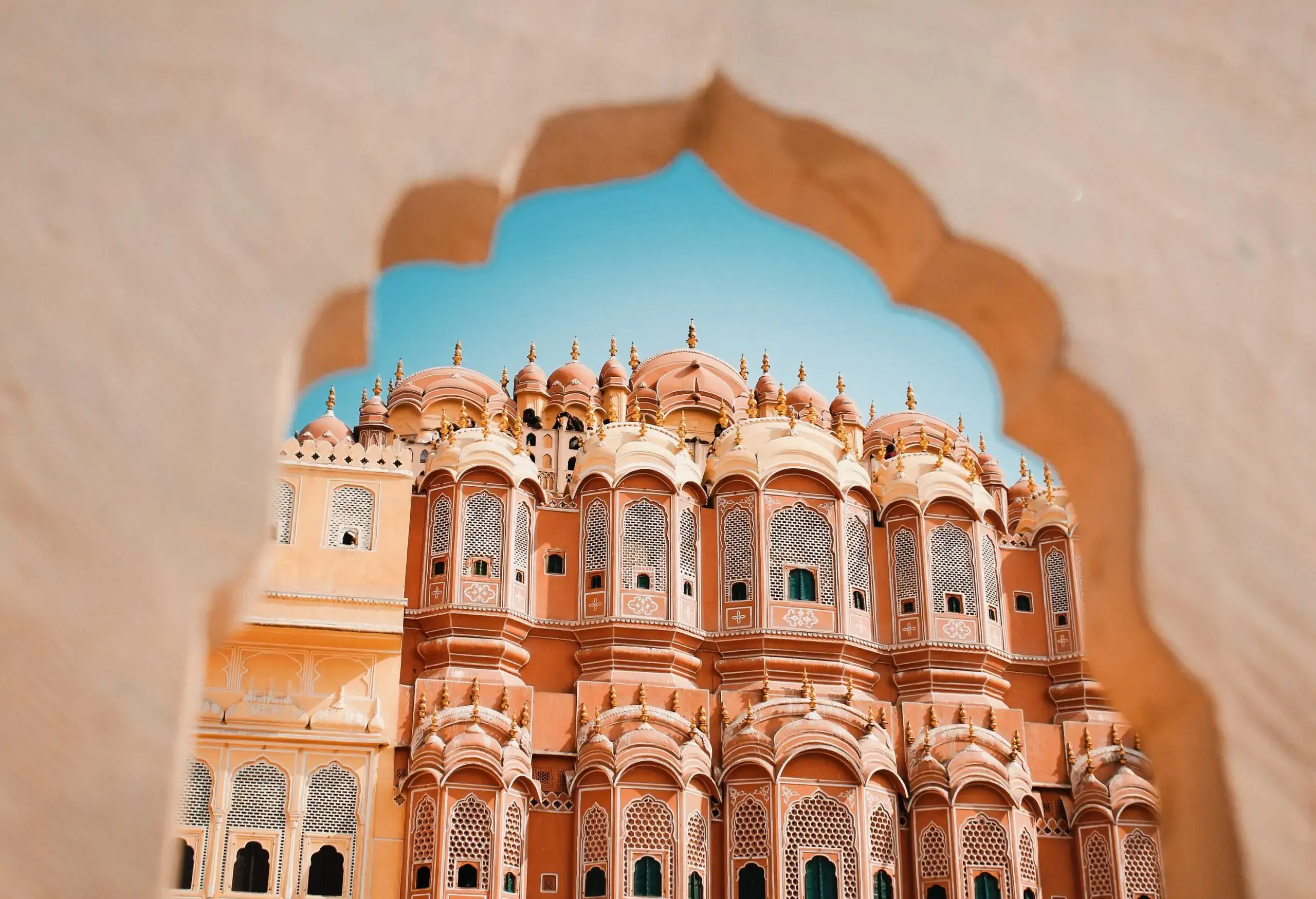 The enchanting Palace of Winds, with its intricate honeycomb-patterned facade and countless ornate windows.