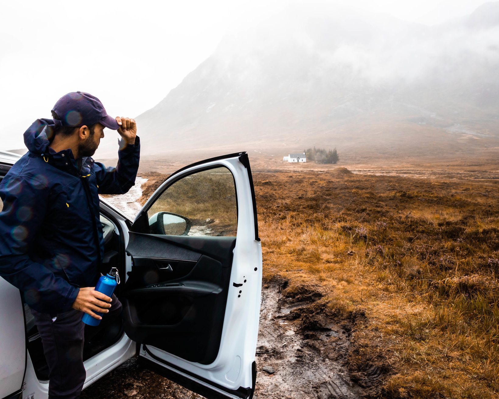 Driving off road with mud and rain in Scotland.