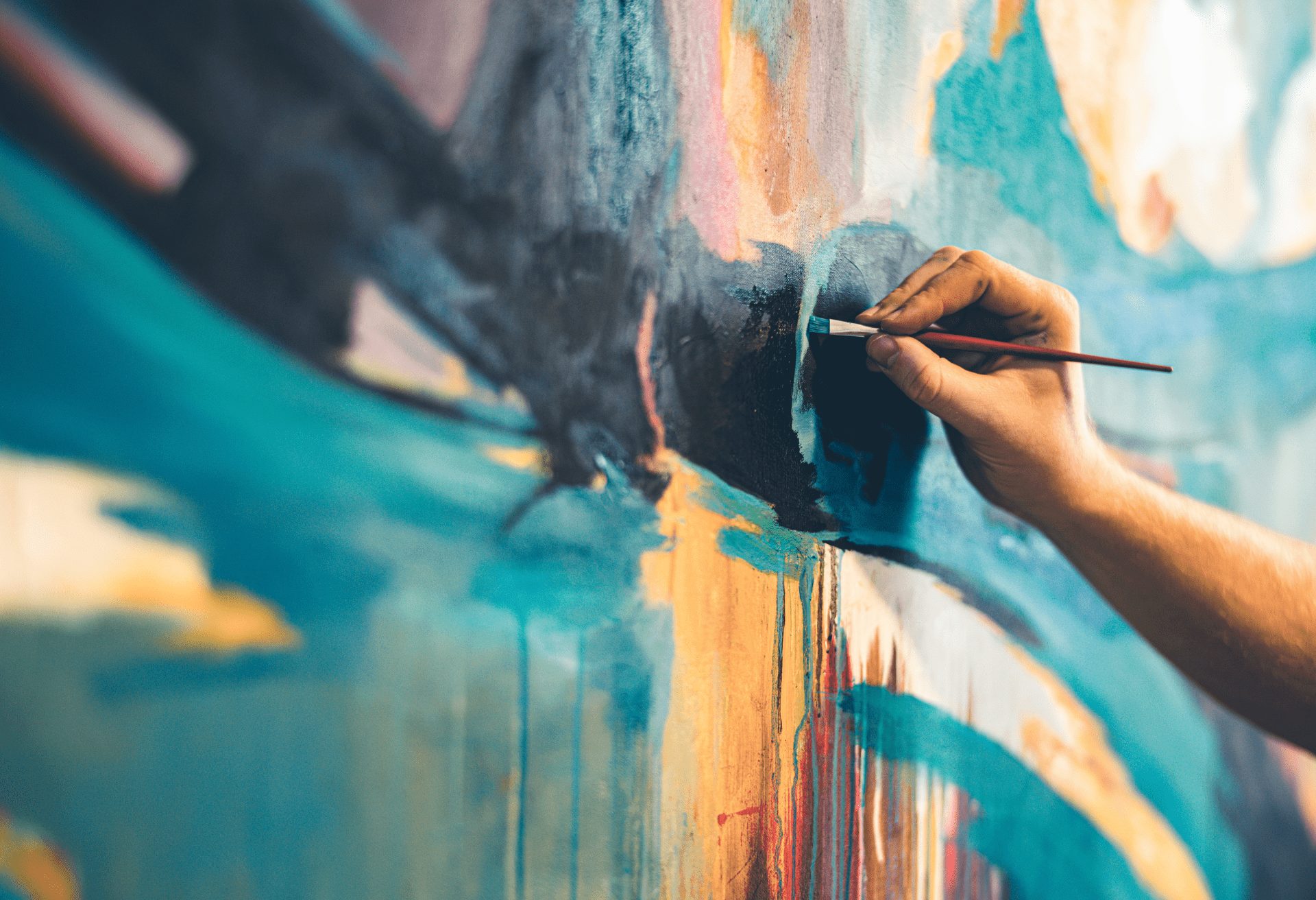 An artist painting a large mural.