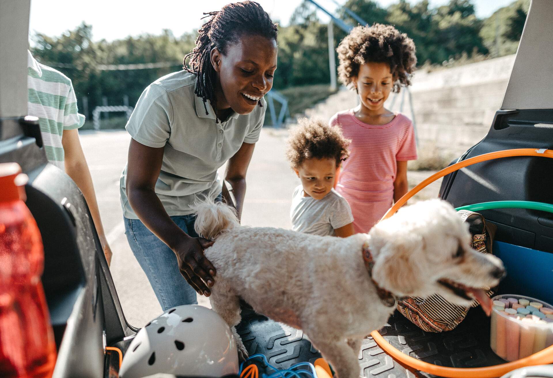 theme_car_roadtrip_dog_people_family_gettyimages-1180401619_universal_within-usage-period_83134