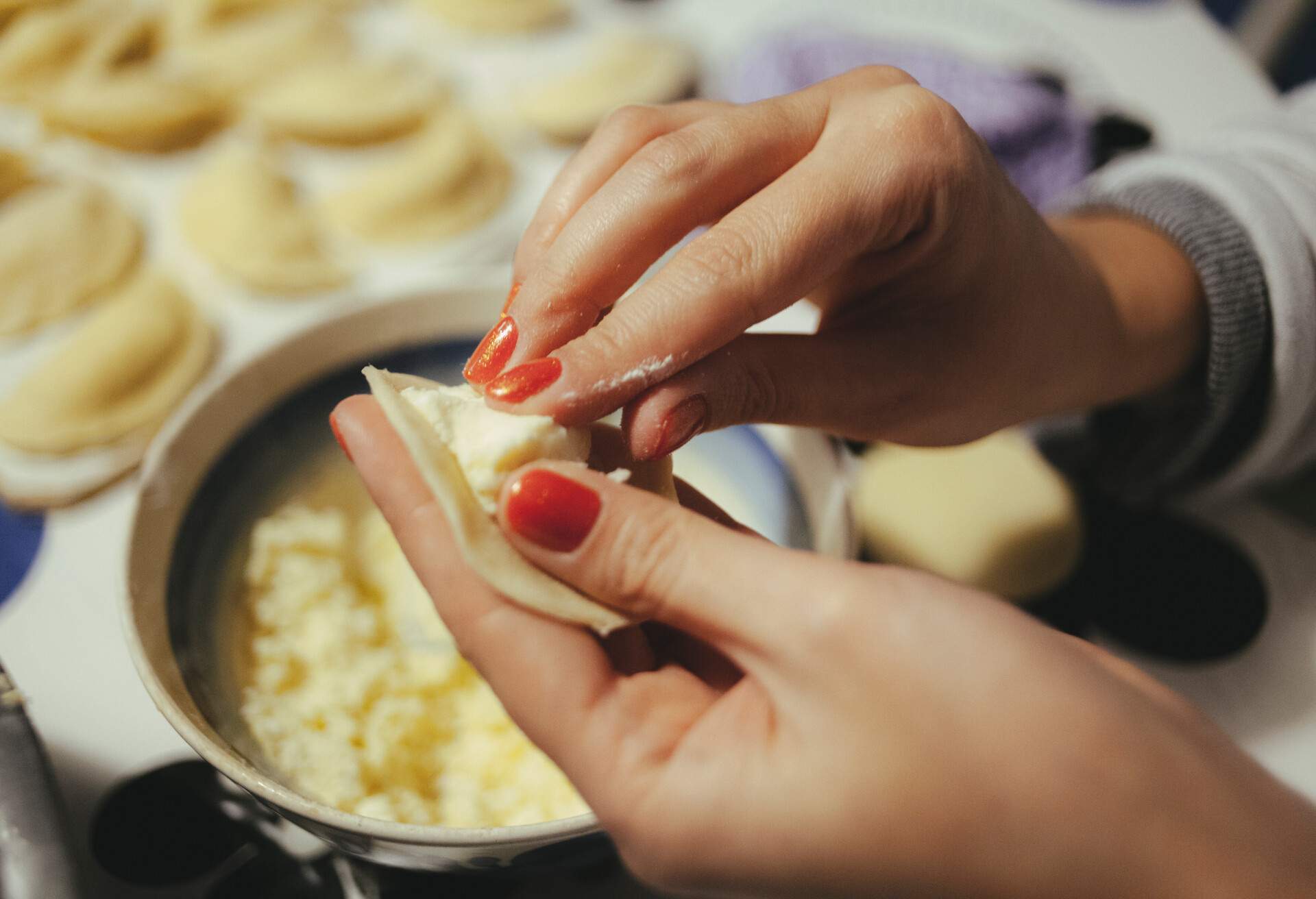 THEME_FOOD_PIEROGI_PREPARING_WOMAN_HAND_GettyImages-908241210.jpg