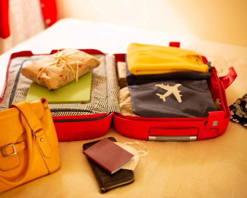 Packed suitcase lying open on bed