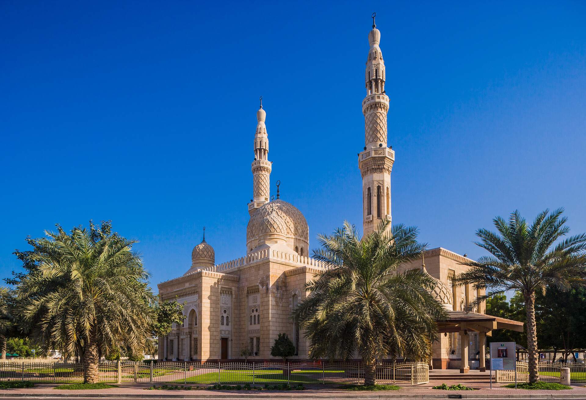 The exquisite Jumeirah Mosque with its two minarets stretching into the deep blue sky.