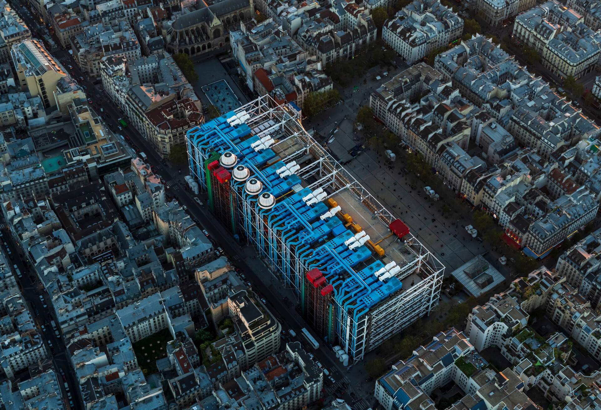 Aerial flying over Paris France looking the city below and Le Centre Pompidou