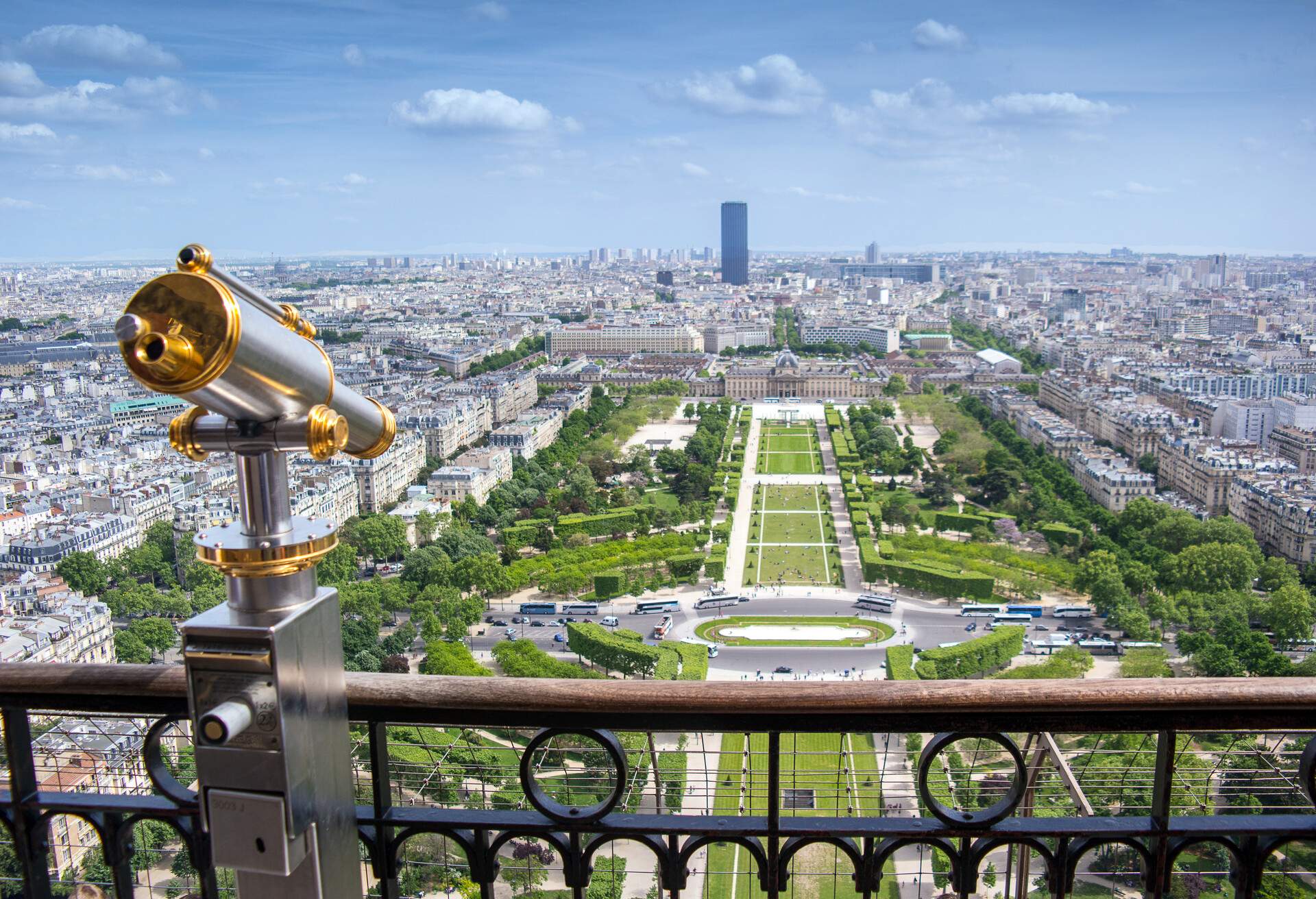 The Eiffel Tower's viewing deck with a telescope and views of the Champ de Mars, Paris, France